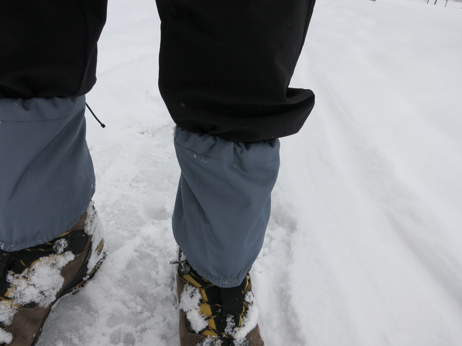 Hiker's boots with short gaiters sealing the trouser cuffs