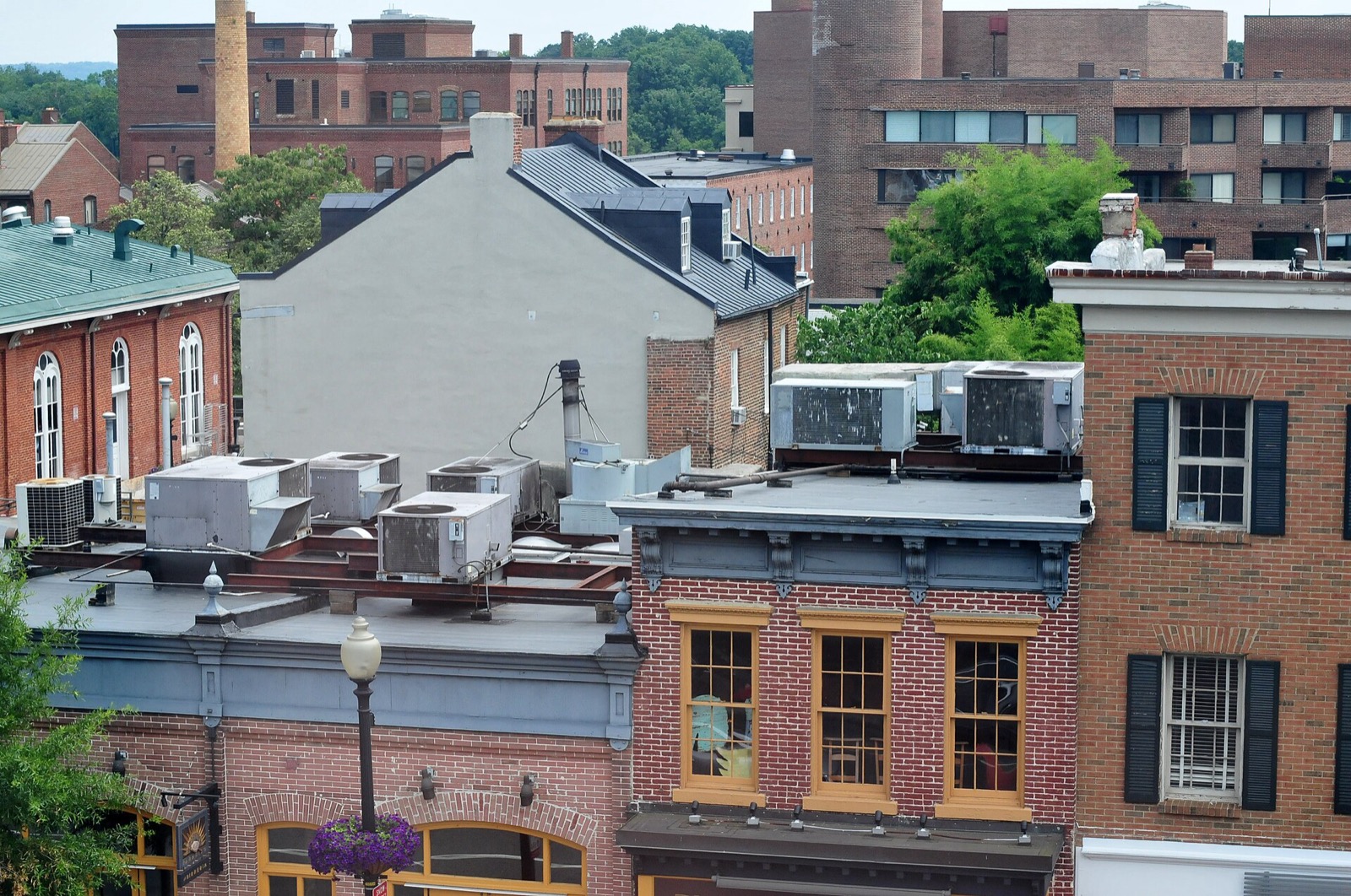 Rooftop air conditioning condensers on brick buildings in Washington, D.C.