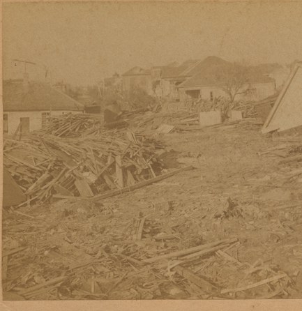 Wrecked wooden houses collapsed into fields of splintered debris after the 1900 Galveston hurricane