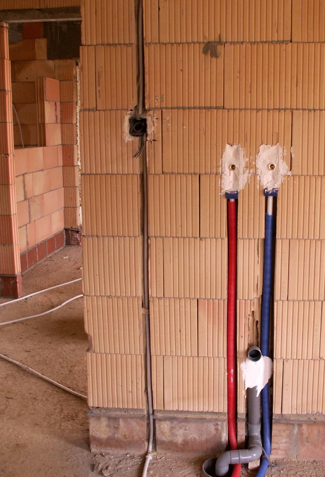 Water supply pipes running inside a building wall, the plumbing an inventory does not cover