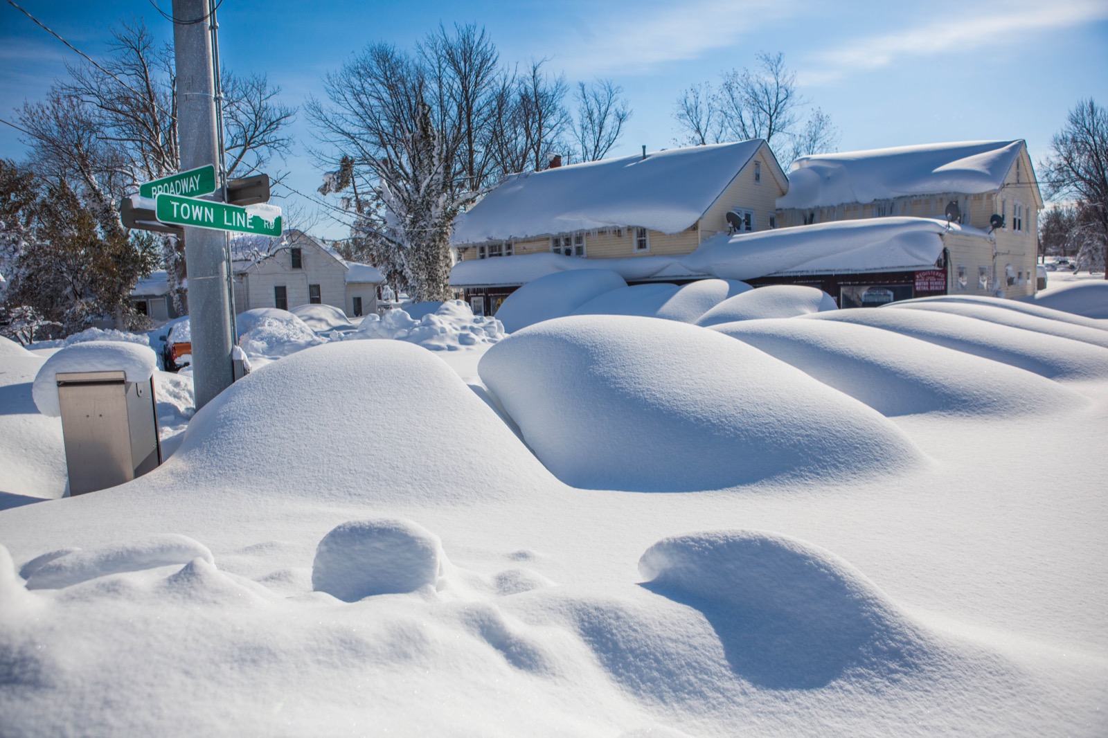 Cars buried to their rooflines in snow at Broadway and Town Line Road near Buffalo after the November 2014 storm