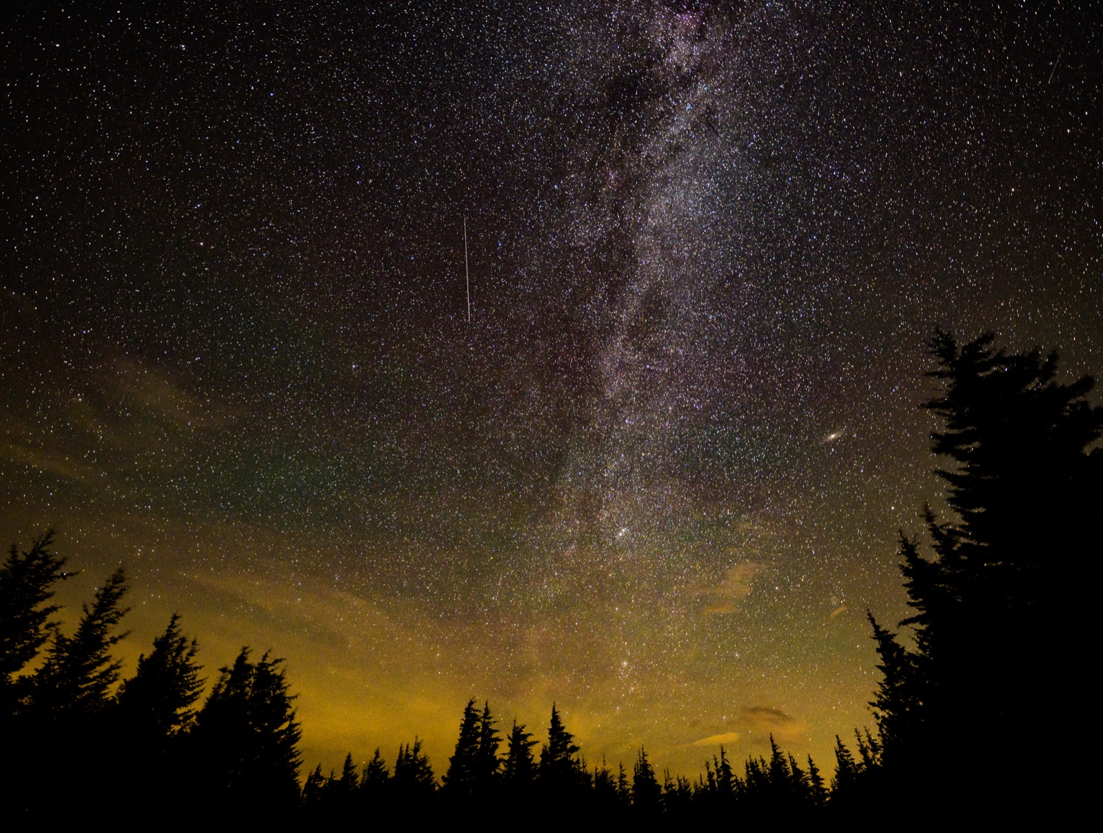 A Perseid meteor streaks past the Milky Way over Spruce Knob, West Virginia