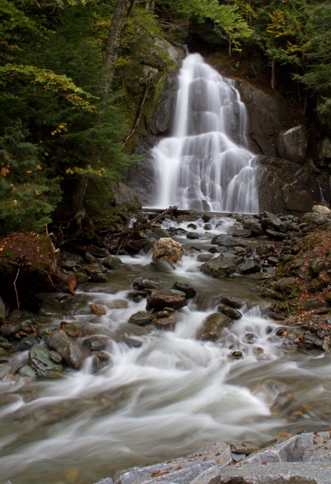 Moss Glen Falls tumbling through mossy rock near Granville