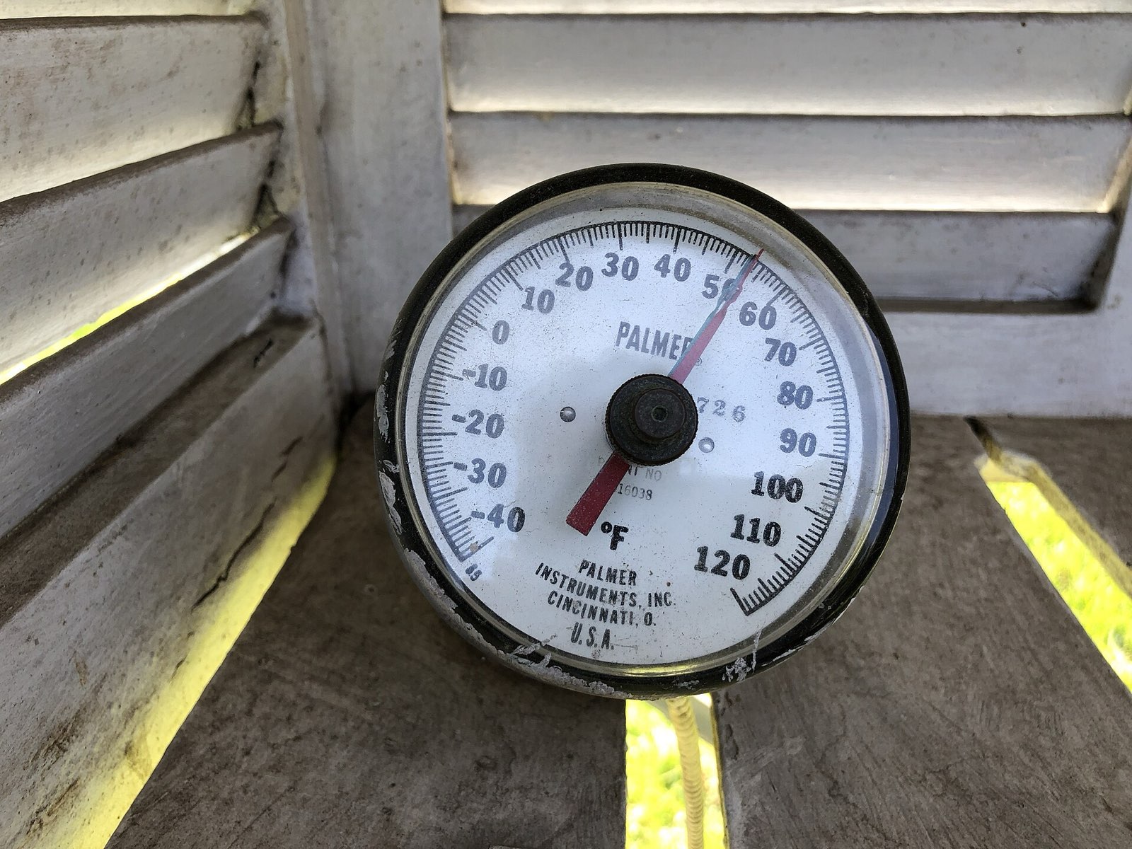 Dial soil thermometer reading in the 50s