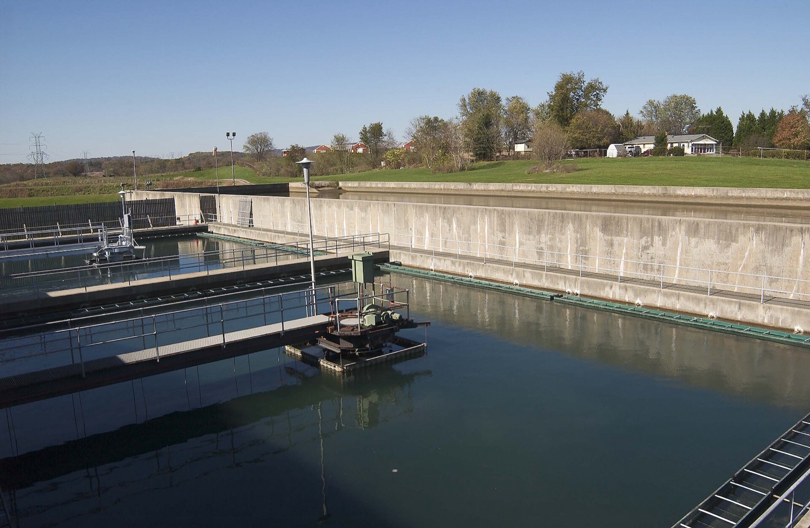 Concrete sedimentation and clarifier basins full of water at a drinking water treatment plant