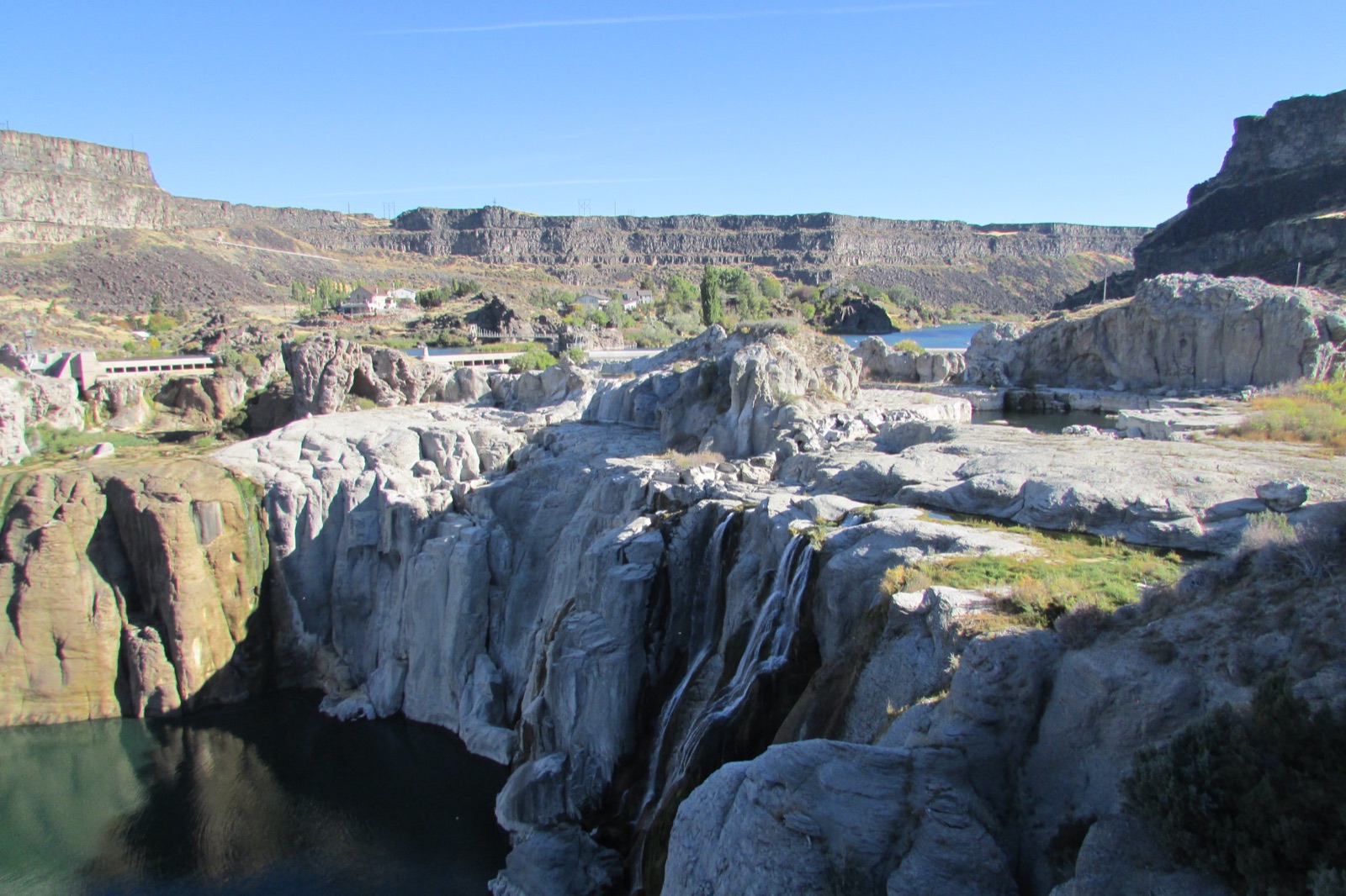 Shoshone Falls in the dry season, the wide basalt brink almost bare with only thin threads of water